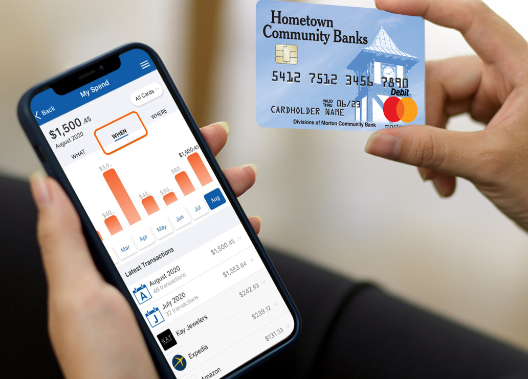 person holder debit card  and checking smartphone for mobile debit card management