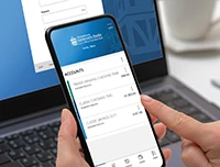 Close up of smartphone with digital banking screen visible.